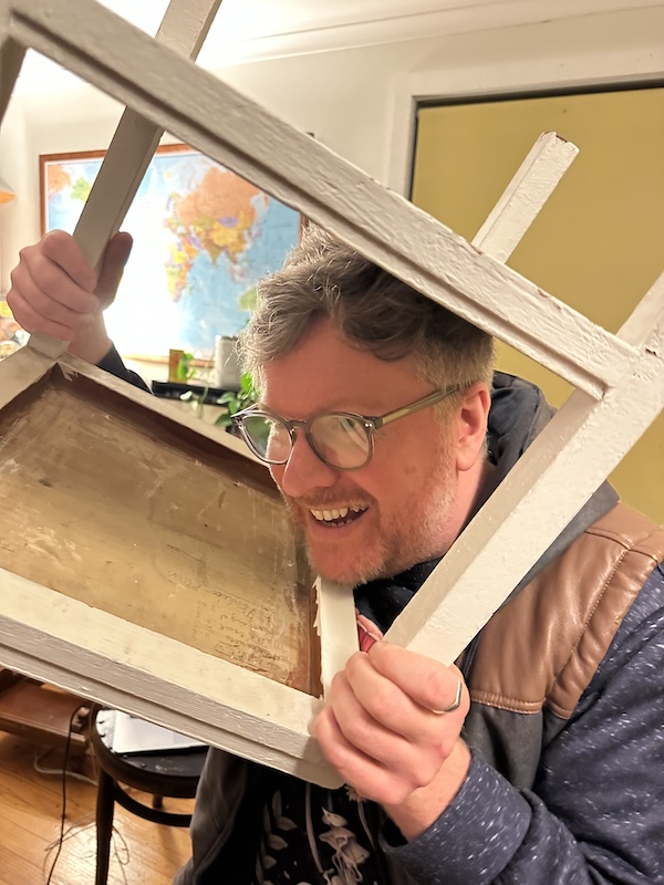 Aaron, with his head stuck in a table