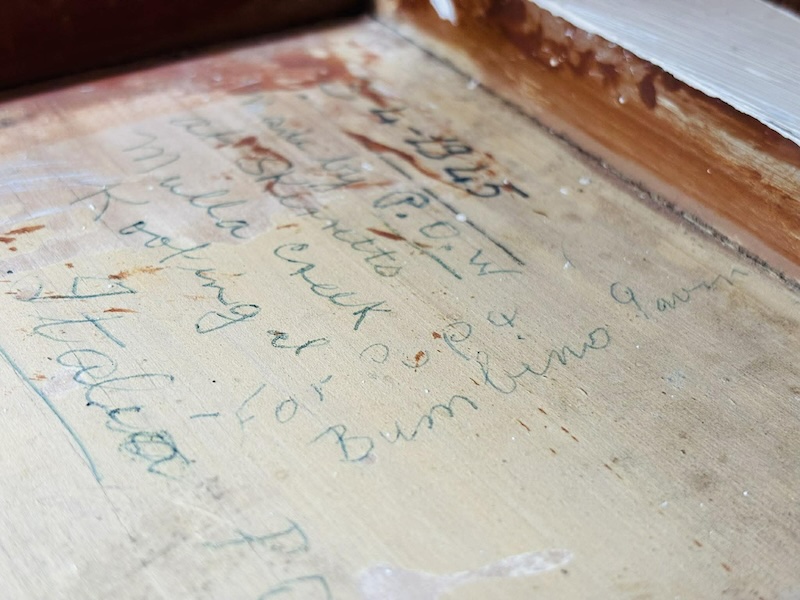 The underside of Aaron's table, on which something is written